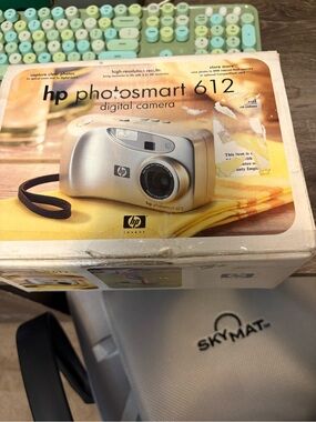 HP Photosmart 612 Digital Camera in Silver with Black Wrist Strap